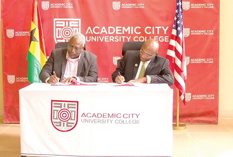 Prof. Fred McBagonluri (left), the President of Academic City University, and Daniel A. Wubah, the President of Millersville University, signing the MoU Prof. Fred McBagonluri (left), the President of Academic City University, and Daniel A. Wubah, the President of Millersville University, signing the MoU