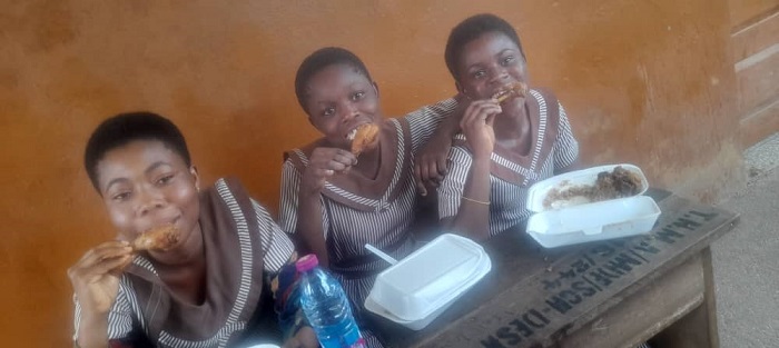 Candidates of the Dadwen JHS enjoying their meals after the last paper.
