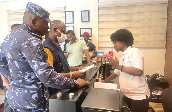 Some members of the GRA taskforce interrogating an employee of one of the hotels visited