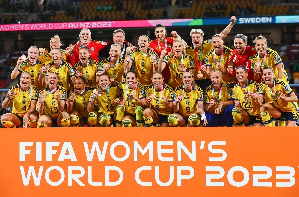 Sweden players celebrate with their bronze medals after winning the Australia and New Zealand 2023 Women’s World Cup third place play-off football match between Sweden and Australia at Brisbane Stadium in Brisbane on August 19, 2023. (Photo by Patrick Hamilton / AFP) Sweden players celebrate with their bronze medals after winning the Australia and New Zealand 2023 Women’s World Cup third place play-off football match between Sweden and Australia at Brisbane Stadium in Brisbane on August 19, 2023. (Photo by Patrick Hamilton / AFP)
