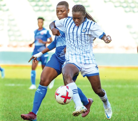 Four-goal heroine Mary Amponsah fends off a challenge from her Amis Du Monde marker Four-goal heroine Mary Amponsah fends off a challenge from her Amis Du Monde marker