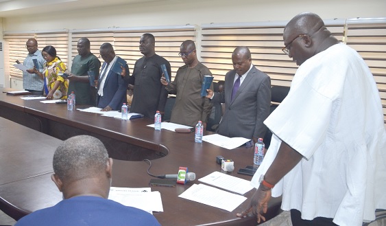Dr Bryan Acheampong (right), Minister of Food and Agriculture, swearing in members of the committee Dr Bryan Acheampong (right), Minister of Food and Agriculture, swearing in members of the committee
