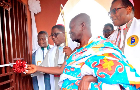 Nana Obaatan Amo Mensah (right), Chief of Gomoa Gyaman, and Most Rev. Dr Paul Boafo, the Presiding Bishop of the Methodist Church Ghana, cutting the tape to rededicate the Ebenezer Society Chapel at Gomoa Gyaman in the Central Region
