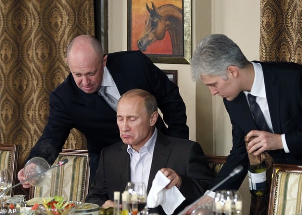 Prigozhin was once considered a close ally of Russian President Vladimir Putin and was known by the nickname 'Putin's chef'. Pictured: Prigozhin serving food to Putin in 2011 'Prigozhin made serious mistakes' - Putin; US now says it doesn't think missile shot down plane