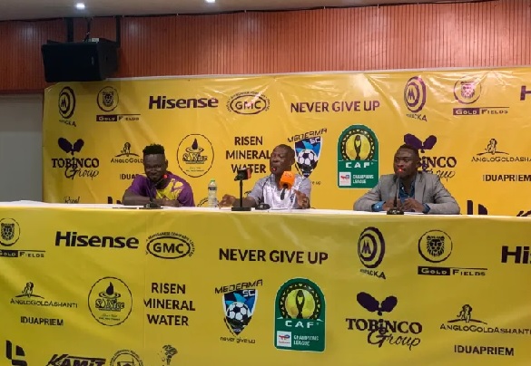 Coach Evans Adotey (middle) speaking at the press conference