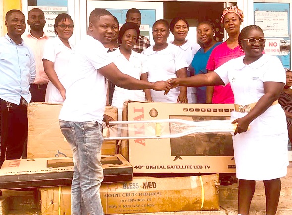 David Amevor (left), Koforidua Area Manager of ASA Savings and Loans Limited, presenting one of the armpit clutches to Beatrice Addai Kwaning, Health Nurses Director of the hospital David Amevor (left), Koforidua Area Manager of ASA Savings and Loans Limited, presenting one of the armpit clutches to Beatrice Addai Kwaning, Health Nurses Director of the hospital