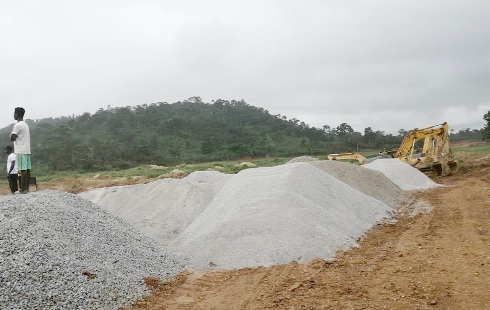 Some heaps of sand, gravel and stone chippings to be used for the construction work