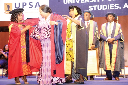 Rebecca Akufo-Addo (2nd from left) being awarded a doctorate degree by officials of the UPSA Rebecca Akufo-Addo (2nd from left) being awarded a doctorate degree by officials of the UPSA