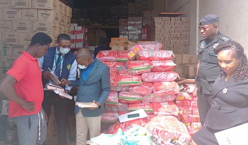John Yaw Buabeng (3rd from left), Head of Enforcement and Debt Management for the Accra South Area of the GRA, inspecting some of the record books of some of the companies John Yaw Buabeng (3rd from left), Head of Enforcement and Debt Management for the Accra South Area of the GRA, inspecting some of the record books of some of the companies