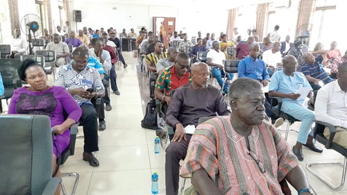Seth Kwame Acheampong (right), Eastern Regional Minister, addressing participants in the RCC meeting in Koforidua
