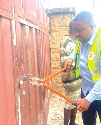 One of the rented premises being closed by an official of the GRDA during the exercise One of the rented premises being closed by an official of the GRDA during the exercise
