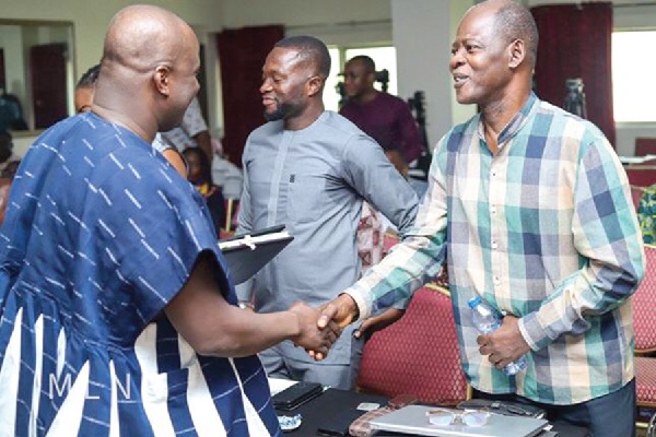 • Samuel Abu Jinapor (left), Minister of Lands and Natural Resources exchanging pleasantries with Dr Steve Manteaw (right), Co-chair, GHEITI, after the event Ghana Lithium Agreement: CSOs call for review of mining Act