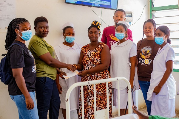 Mrs Gladys Opuni (second left) Director of Programmes at HOGF presenting a cheque to Mrs Juliana Nyarkoh (4th right) Mrs Gladys Opuni (second left) Director of Programmes at HOGF presenting a cheque to Mrs Juliana Nyarkoh (4th right)