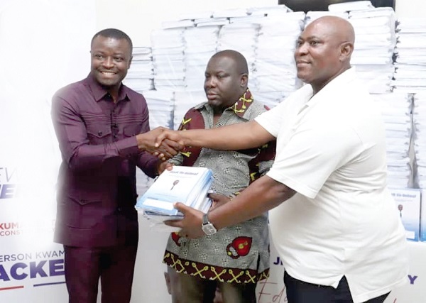 Jefferson Sackey (left), the Deputy Communications Director, Office of the President, presenting some books to Robert Kwame Dadzie Okine (right), the NPP Chairman of Ablekuma Central. With them is Emmanuel Tetteh Okine, Electoral Area Coordinator, Abossey Okine Jefferson Sackey (left), the Deputy Communications Director, Office of the President, presenting some books to Robert Kwame Dadzie Okine (right), the NPP Chairman of Ablekuma Central. With them is Emmanuel Tetteh Okine, Electoral Area Coordinator, Abossey Okine