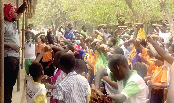 • Augustus K. Agbozo (left), Ghana National Taekwondo Team Coach, taking the pupils through some technics UG Basic School pupils schooled on self-defence