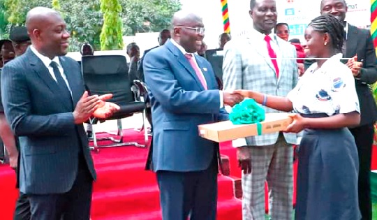 • Dr Mahamudu Bawamia (2nd from left), the Vice-President, presenting a laptop to Christine Assan. Looking on are Dr Yaw Osei Adutwum (2nd from right), Minister of Education, and Kojo Oppong Nkrumah (left), Minister of Information • Dr Mahamudu Bawamia (2nd from left), the Vice-President, presenting a laptop to Christine Assan. Looking on are Dr Yaw Osei Adutwum (2nd from right), Minister of Education, and Kojo Oppong Nkrumah (left), Minister of Information
