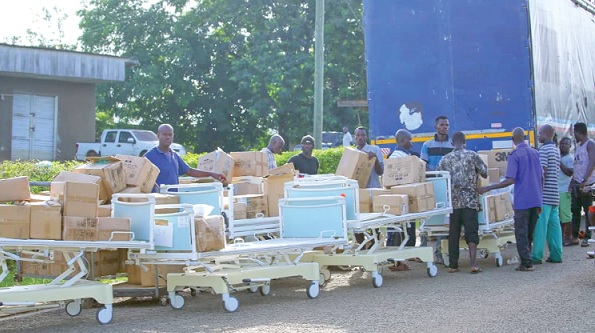 Representatives of the beneficiary hospitals inspecting the equipment after receiving them Representatives of the beneficiary hospitals inspecting the equipment after receiving them