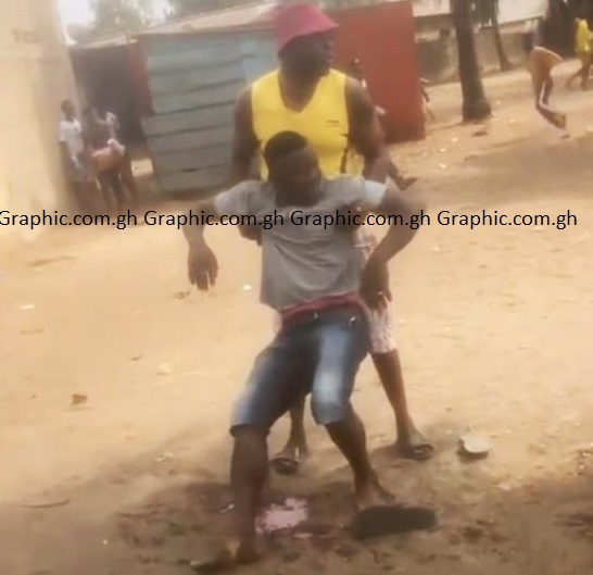 The injured rider being helped onto his feet soon after the shooting incident Okada rider, immigration officer shot at Aflao border