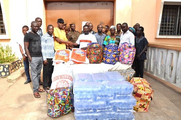 David Kwaku Danku (middle), presenting the items to Deputy Superintendent of Prisons Sylvester Fiadzigbe (third left) while others look on David Kwaku Danku (middle), presenting the items to Deputy Superintendent of Prisons Sylvester Fiadzigbe (third left) while others look on