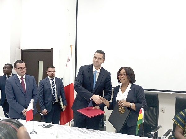 Shirley Ayorkor Botchwey (right), Minister of Foreign Affairs and Regional Integration, and Dr Ian Borg, Maltese Minister of Foreign, European Affairs and Trade, exchanging documents after signing the MoU Explore Africa through — Foreign Affairs Minister