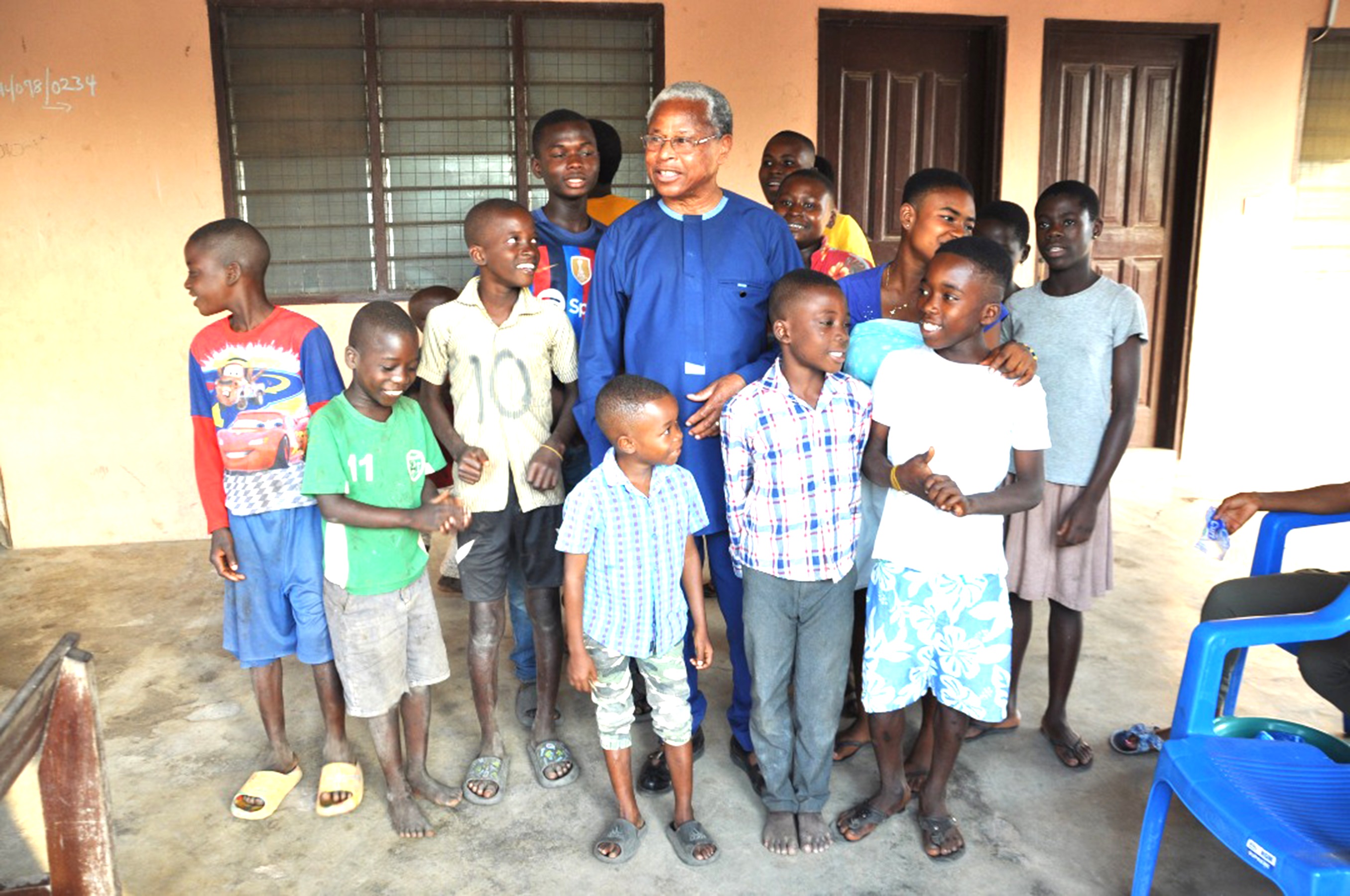 Mr Benjamin Kpodo, MP Ho Central, with the children at the Cured Lepers Village, Ho. Ho MP spends Christmas with children