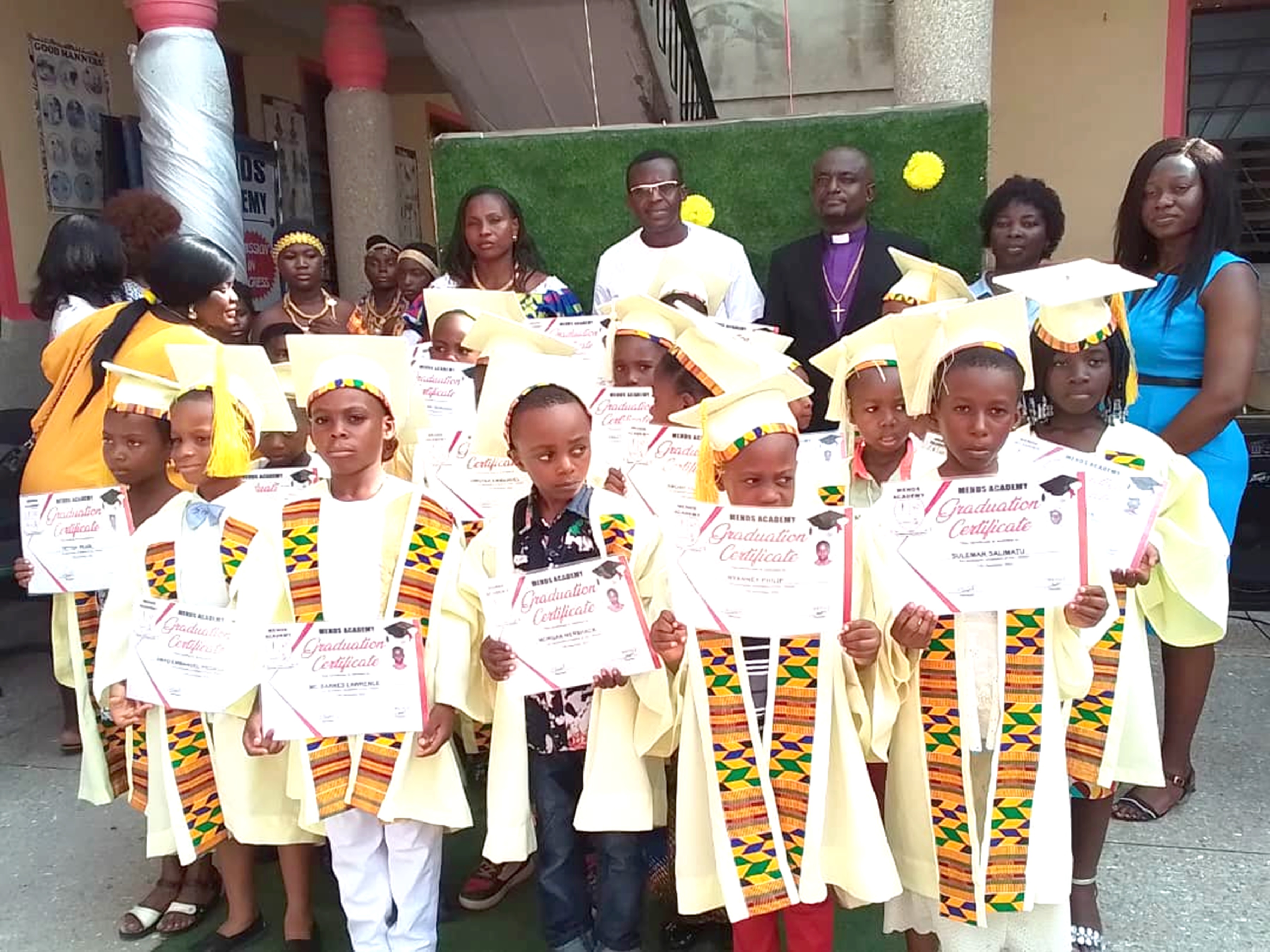 Graduands with dignitaries after the ceremony. Set up scholarships for brilliant, needy children