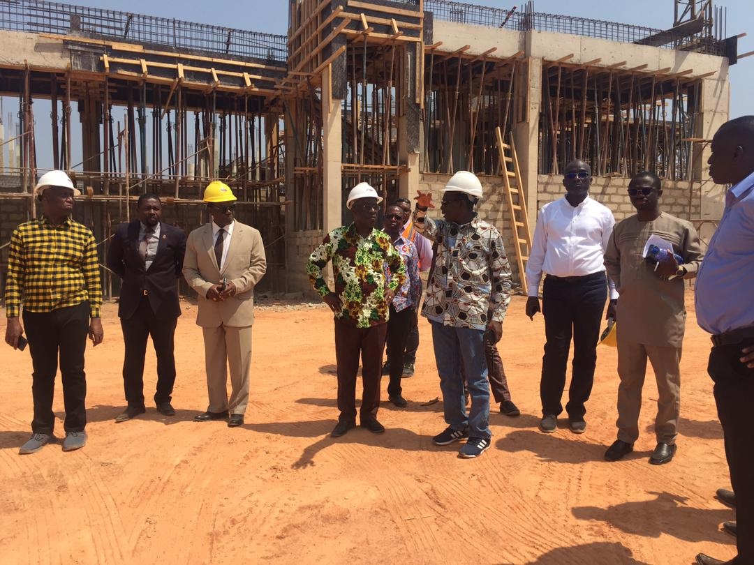 Members of the Governing Council of the UCC at a construction site on an encroached portion of the university’s land Members of the Governing Council of the UCC at a construction site on an encroached portion of the university’s land