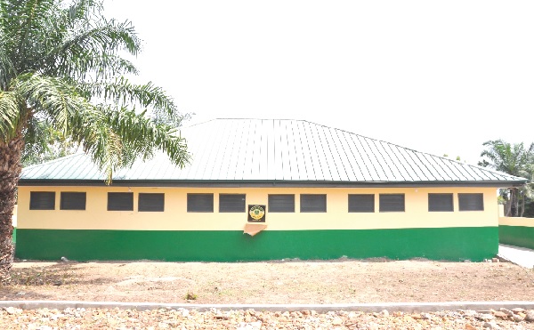 •The washroom. INSET: Theresa Potakey (2nd from left), President of OMSU’84, shaking hands with Jonathan Gustav Adomah, the headmaster of the school, after the handover ceremony Mawuli School gets psychiatric nurse, washroom