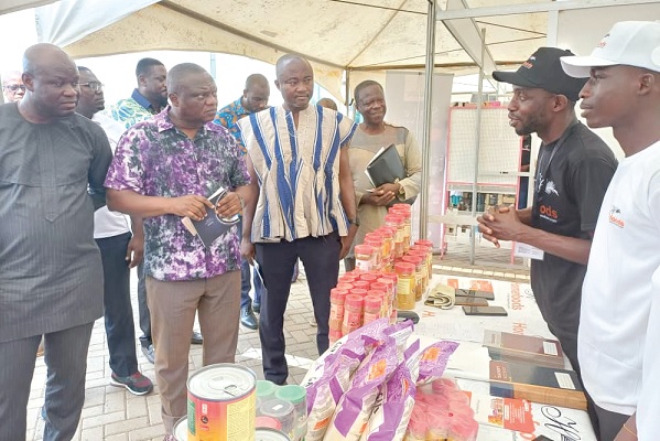 Officials of Home Foods and Cannery Limited explaining how the products are manufactured to Clement Osei-Amoako (2nd from left), President, GNCCI. With them are Mark Badu-Aboagye (left), CEO, GNCCI, and Benjamin Asiam (3rd from left), Deputy Chief Commercial Officer, MoTI Officials of Home Foods and Cannery Limited explaining how the products are manufactured to Clement Osei-Amoako (2nd from left), President, GNCCI. With them are Mark Badu-Aboagye (left), CEO, GNCCI, and Benjamin Asiam (3rd from left), Deputy Chief Commercial Officer, MoTI