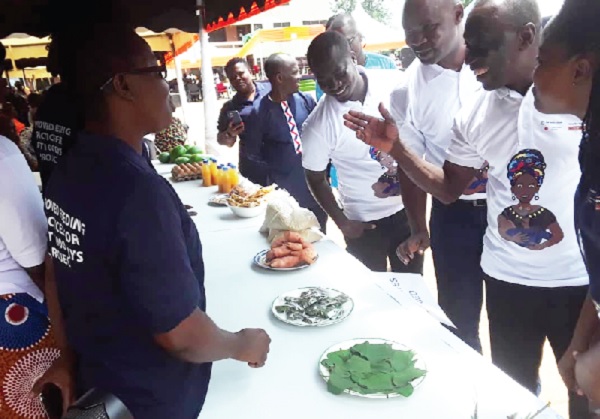 The dignitaries inspecting some of the products produced by the community members The dignitaries inspecting some of the products produced by the community members