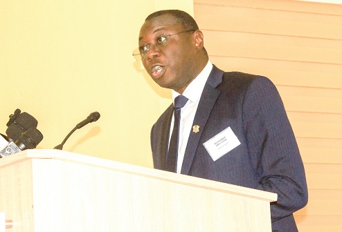 Mohammed Amin Adam (inset), Minister of State at the Ministry of Finance, delivering his address at the conference. Picture: ERNEST KODZI Mohammed Amin Adam (inset), Minister of State at the Ministry of Finance, delivering his address at the conference. Picture: ERNEST KODZI
