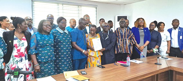 Members of the board and management of IMaH with the team from the NHIS after the ceremony Members of the board and management of IMaH with the team from the NHIS after the ceremony