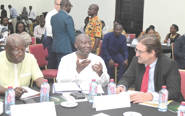 Ken Ofori-Atta (middle), Minister of Finance, chatting with Daniel Krull, German Ambassador to Ghana, at the first workshop on the Global Shield against Climate Risks and Global Risk Modelling Alliance in Accra. On his right is Dr Kwaku Afriyie, Minister of Environment, Science, Technology & Innovation. Picture : Emmanuel Quaye Ken Ofori-Atta (middle), Minister of Finance, chatting with Daniel Krull, German Ambassador to Ghana, at the first workshop on the Global Shield against Climate Risks and Global Risk Modelling Alliance in Accra. On his right is Dr Kwaku Afriyie, Minister of Environment, Science, Technology & Innovation. Picture : Emmanuel Quaye