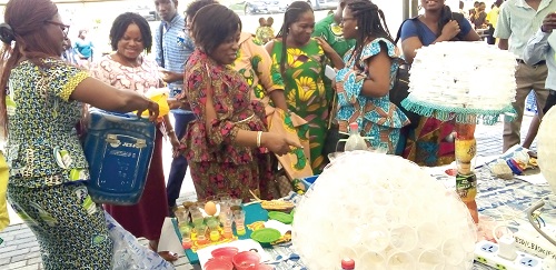 Some of the guests admiring some of the products from plastic waste Some of the guests admiring some of the products from plastic waste