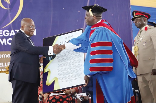 Prof. William Kofi Koomson (right), Vice-Chancellor, VVU, presenting a citation to President Akufo-Addo at the 1st Special Congregation at Valley View University at Oyibi.  Picture: SAMUEL TEI ADANO