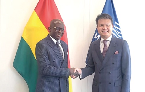 Godfred Yeboah Dame (left) in a handshake with Daren Tang, Director-General of the World Intellectual Property Organisation, on the sidelines of the General Assembly of Member States of the WIPO in Geneva