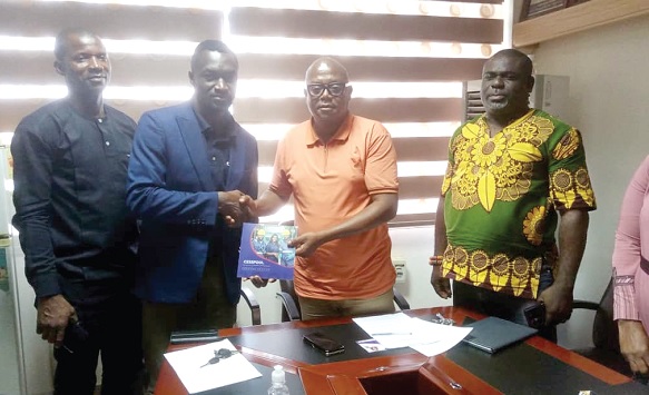 Dominic Aboagye (2nd from left), CEO, iCesspool Services Limited, presenting the manual of the online system to Sule Salifu (2nd from right), MCE of Tamale. Looking on is Martin Ahorlu (right), Director of Waste Management at TaMA, and another official Dominic Aboagye (2nd from left), CEO, iCesspool Services Limited, presenting the manual of the online system to Sule Salifu (2nd from right), MCE of Tamale. Looking on is Martin Ahorlu (right), Director of Waste Management at TaMA, and another official