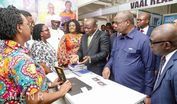 Samuel Abu Jinapor (3rd from right), Minister of Lands and Natural Resources, with Dr Ernest Addison (2nd from right), Governor, Bank of Ghana, Barbara Oteng Gyasi (4th from right), Board Chair, Minerals Commission, and other officials interacting with some exhibitors