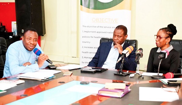 Dr Da-Costa Aboagye (left), Director of Health Promotion Division, giving a remark. With him are Dr Kuma -Aboagye (middle), Director-General of GHS, and Prof. Elsie Effah Kaufmann