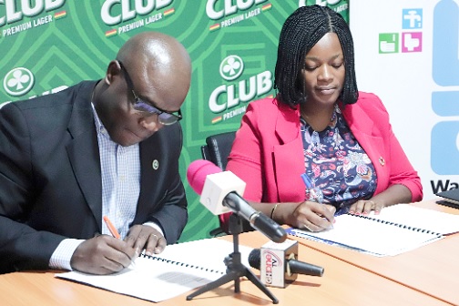 Solomon Yaw Ayiah (left), Country Lead, Legal and Corporate Affairs, Accra Brewery Limited and Ewurabena Yanyi-Akofur (right), Country Director, WaterAid Ghana, signing the memorandum of understanding. Picture: EDNA SALVO-KOTEY