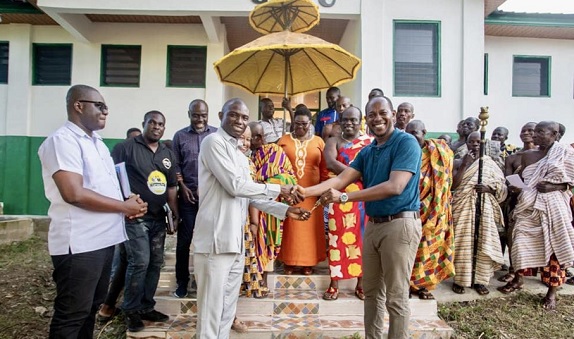 Thomas Pinto (right), Project Consultant, presenting the keys of the 12-unit sanitary facility at Mando SHTS, to Dr Dominic Eduah (arrowed), Executive Director, GNPC Foundation, and Moses Antwi Benefo (left), Head of Media & PR at GNPC Foundation Thomas Pinto (right), Project Consultant, presenting the keys of the 12-unit sanitary facility at Mando SHTS, to Dr Dominic Eduah (arrowed), Executive Director, GNPC Foundation, and Moses Antwi Benefo (left), Head of Media & PR at GNPC Foundation