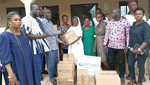 Joseph Mensah (3rd from left) presenting the drugs to Cecilia Appiah, the midwife at the clinic Joseph Mensah (3rd from left) presenting the drugs to Cecilia Appiah, the midwife at the clinic