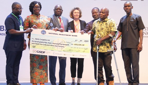 Gifty Twum Ampofo (2nd from left), Deputy Minister of Education, and Fred Kyei Asamoah (left), Director General, Commission for Technical and Vocational Education and Training, presenting a dummy cheque to representatives of Vgoly Company Ltd, one of the beneficiaries of Ghana Skills Development Fund. Picture: ELVIS NII NOI DOWUONA
