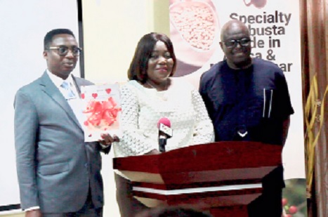 Prof. Charles Tortoe (left), Director, CSIR-FRI; Ivy Cynthia-Osei Sampah (middle), Executive Secretary, Coffee Federation of Ghana, and Larry Attipoe, National Coordinator, ITC, launching the handbook