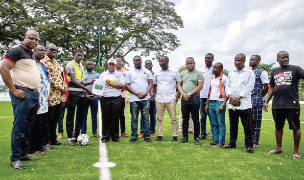 Loubabat Habib-Jawulaa of GNPC receiving the Maintenance Manual of the astro turf from a representative of Sekyere South Assembly, while other officials look on Loubabat Habib-Jawulaa of GNPC receiving the Maintenance Manual of the astro turf from a representative of Sekyere South Assembly, while other officials look on