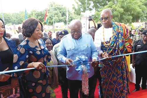 President Akufo-Addo being assisted by Shirley Ayorkor Botchwey (left), Minister of Foreign Affairs and Regional Integration, and Godfred Nii Ashie Dzanie (right), Chief of La Bawaleshie, to inaugurate the facility in Accra. Picture: SAMUEL TEI ADANO President Akufo-Addo being assisted by Shirley Ayorkor Botchwey (left), Minister of Foreign Affairs and Regional Integration, and Godfred Nii Ashie Dzanie (right), Chief of La Bawaleshie, to inaugurate the facility in Accra. Picture: SAMUEL TEI ADANO