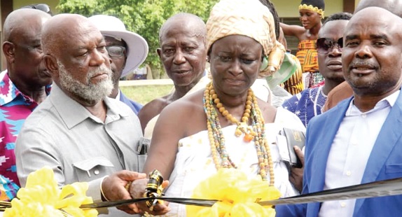 Nana Anmoa Framoh, Bankahemaa, being assisted by Prof. Kwame Karikari (left) to cut the tape for the construction of the sports complex. With them is Christopher Appiah Mensah (right), Headmaster of the school. Pictures: EMMANUEL BAAH Nana Anmoa Framoh, Bankahemaa, being assisted by Prof. Kwame Karikari (left) to cut the tape for the construction of the sports complex. With them is Christopher Appiah Mensah (right), Headmaster of the school. Pictures: EMMANUEL BAAH