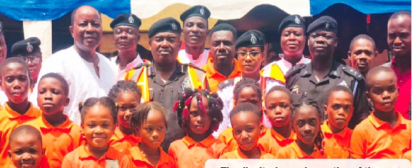 The dignitaries and a section of the schoolchildren after the road sensitisation 