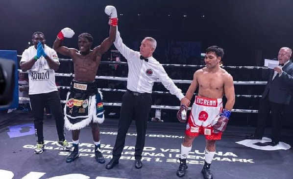 Alfred Lamptey (left) being declared winner of the bout