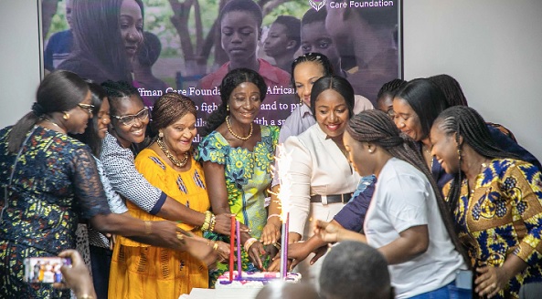 Dr Bernadette Hoffman (arrowed), the Founding President of the foundation, cutting a cake with some of the guests to officially launch the foundation Dr Bernadette Hoffman (arrowed), the Founding President of the foundation, cutting a cake with some of the guests to officially launch the foundation